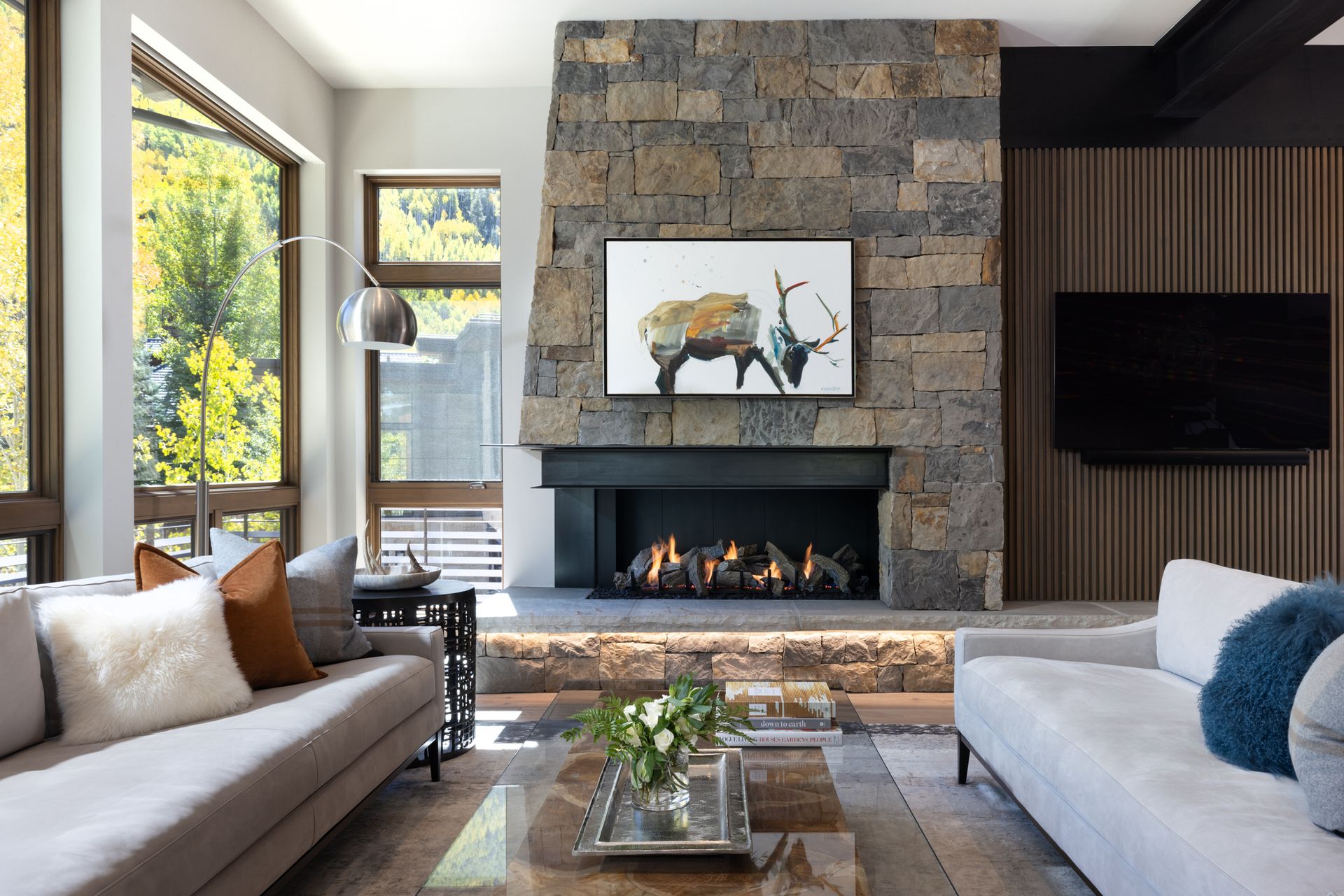 There is a dining table and chairs in the middle of the room.