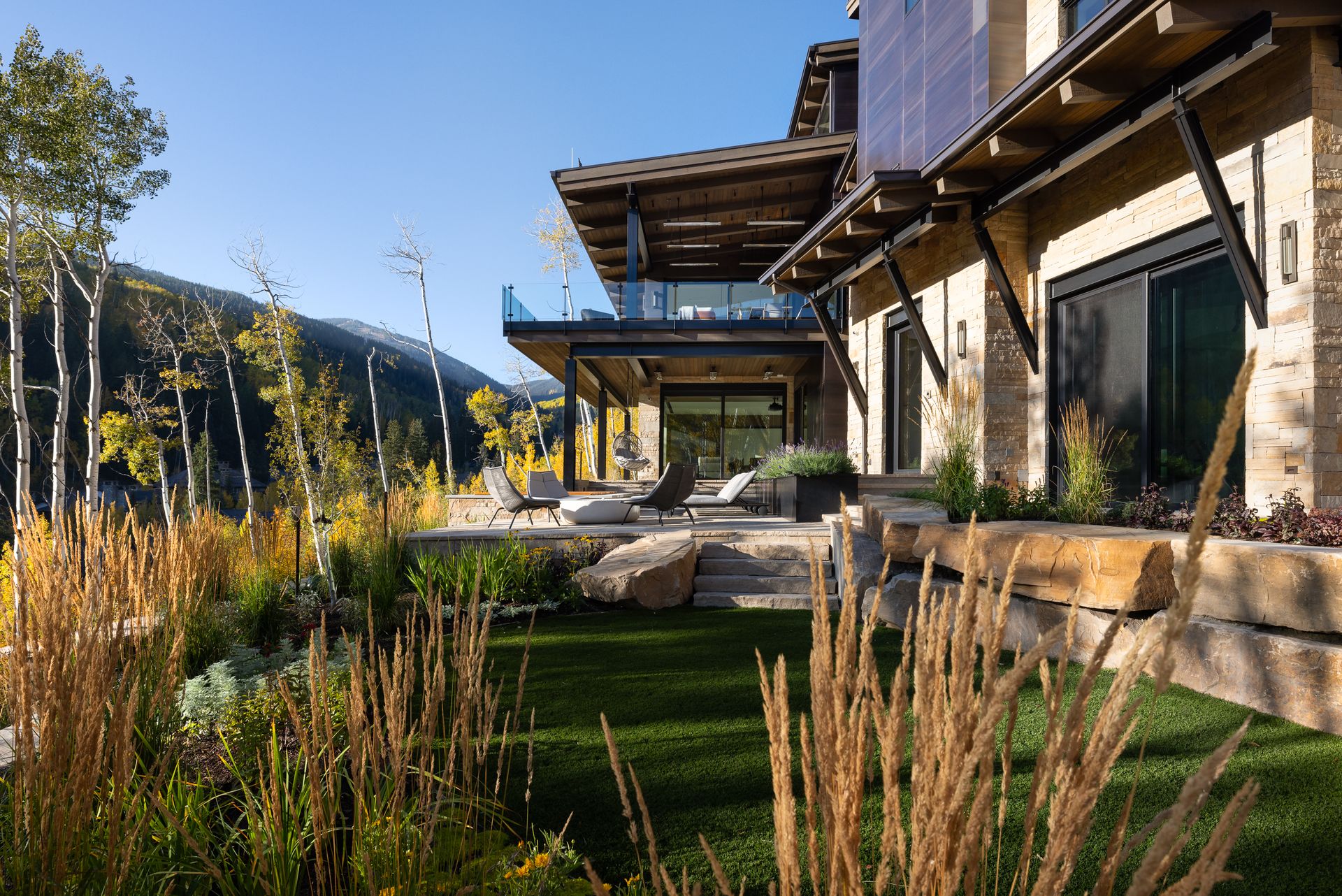 A large house with a large lawn in front of it.