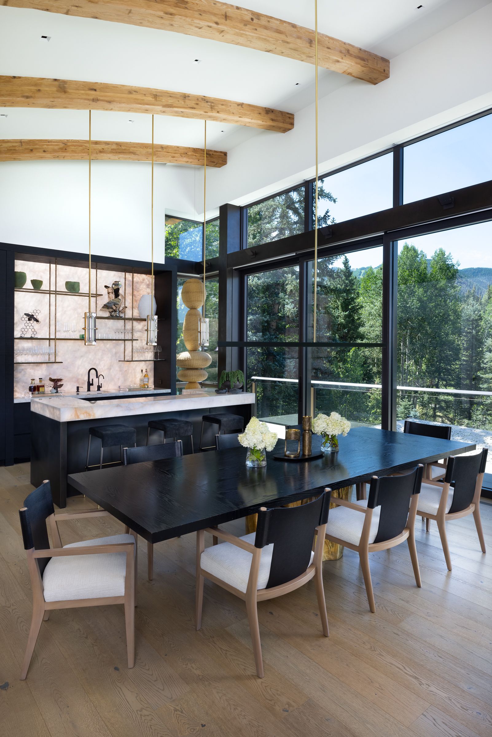 A dining room with a large table and chairs