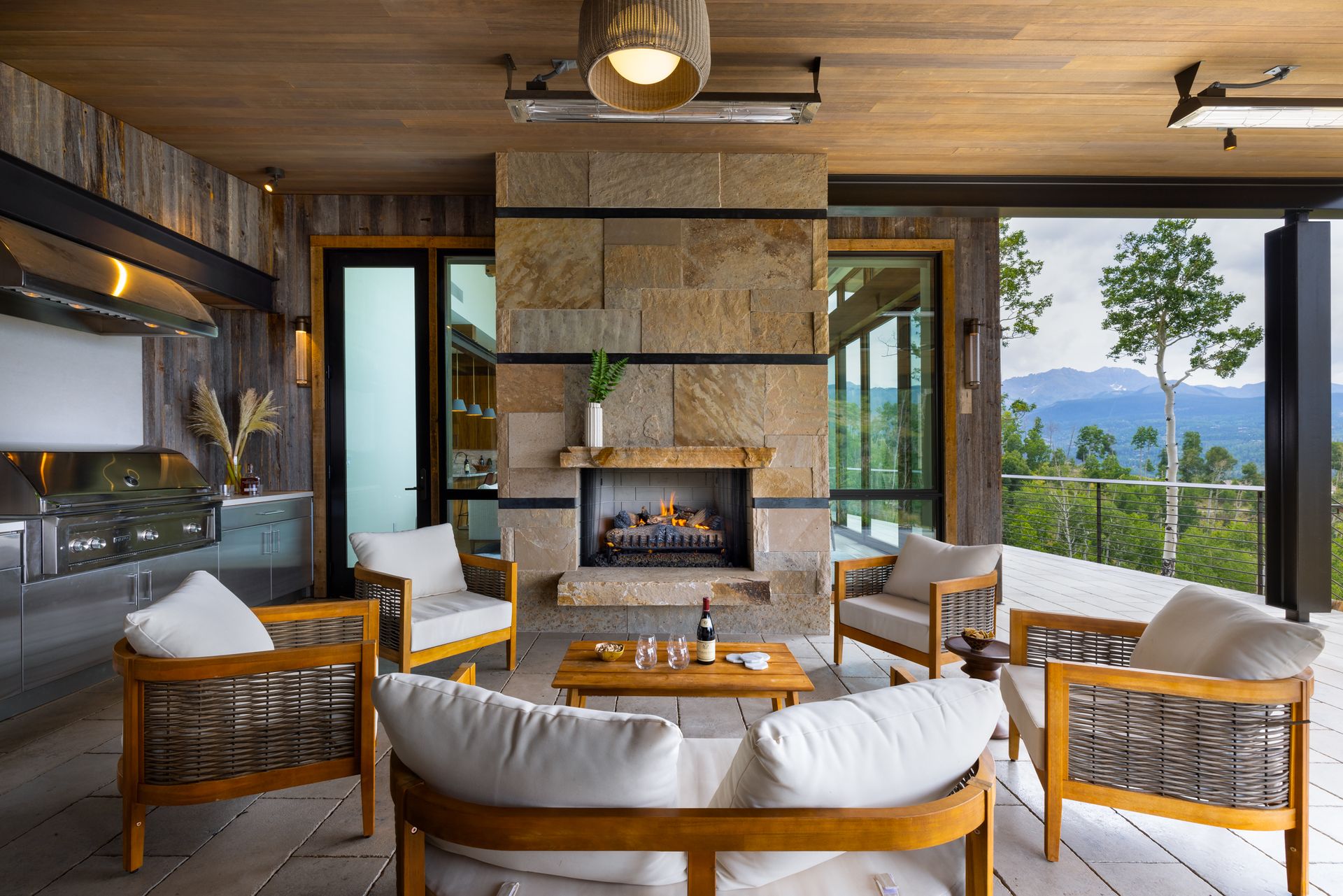 There is a fireplace in the middle of the living room.