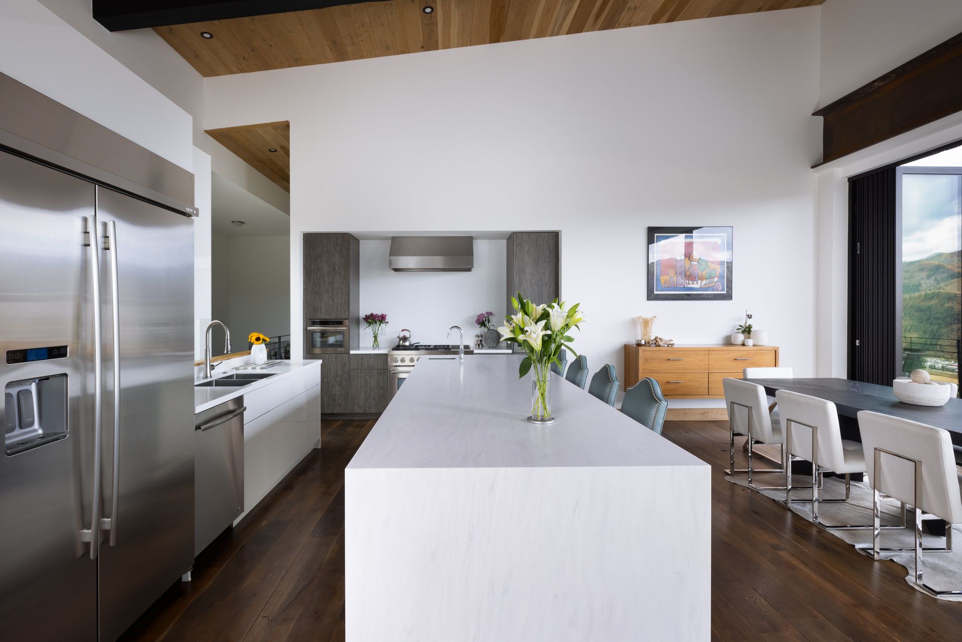 A kitchen with stainless steel appliances and a large island