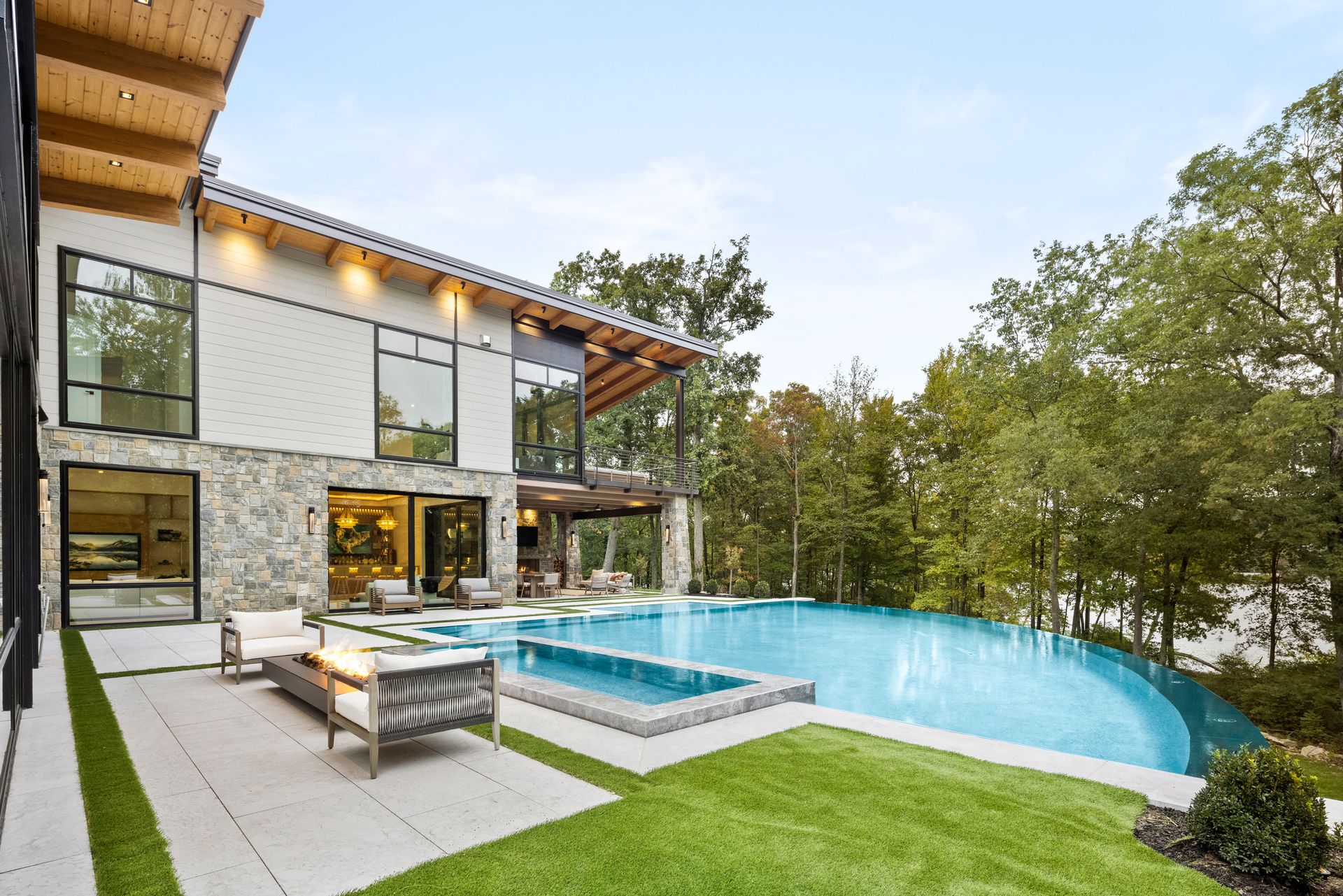 A large house with a large swimming pool in the backyard.