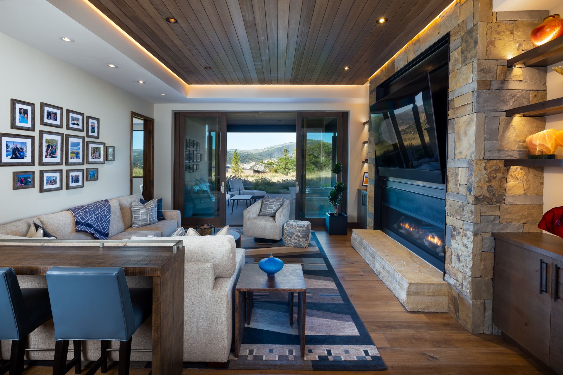 There is a fireplace in the middle of the living room.