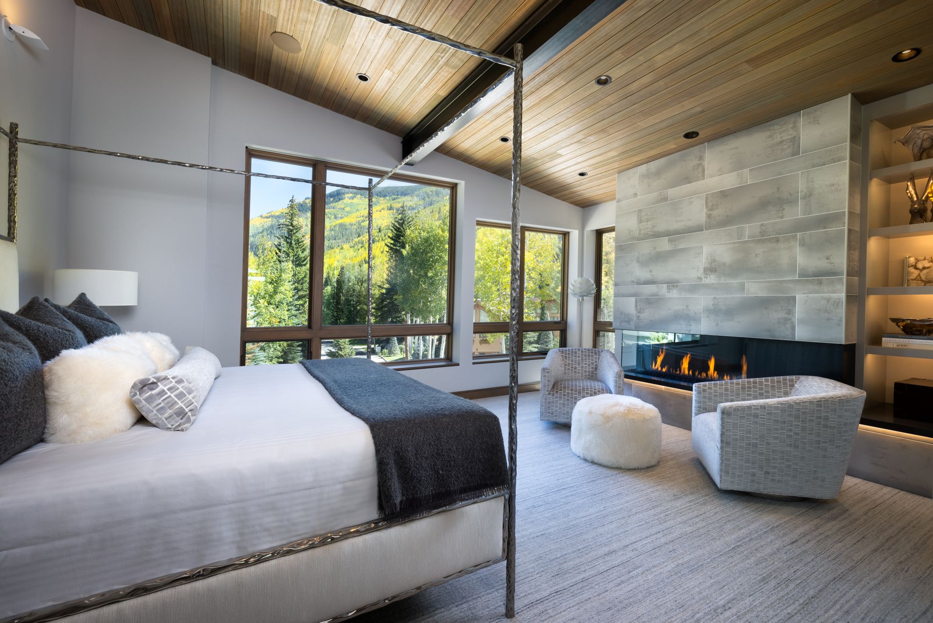 A patio with a table and chairs and a grill