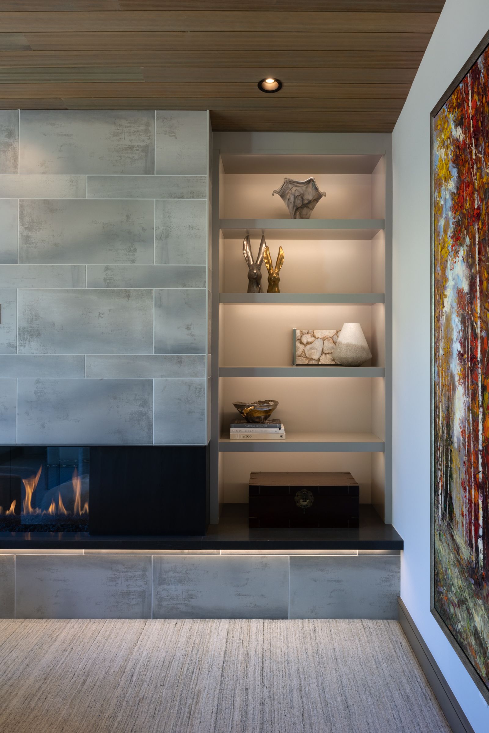 A bedroom with a canopy bed and a fireplace.