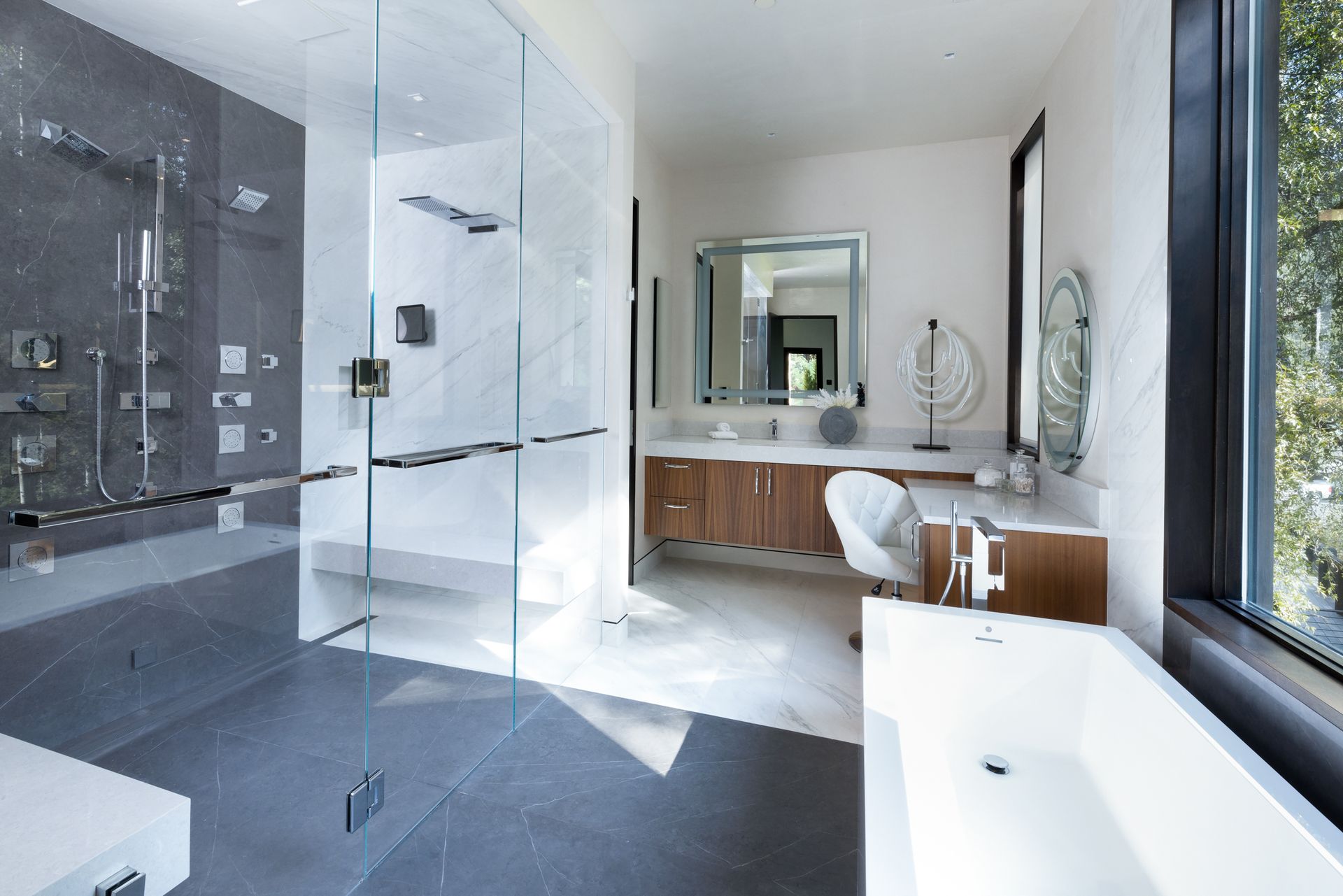 A bathroom with a walk in shower and a bathtub