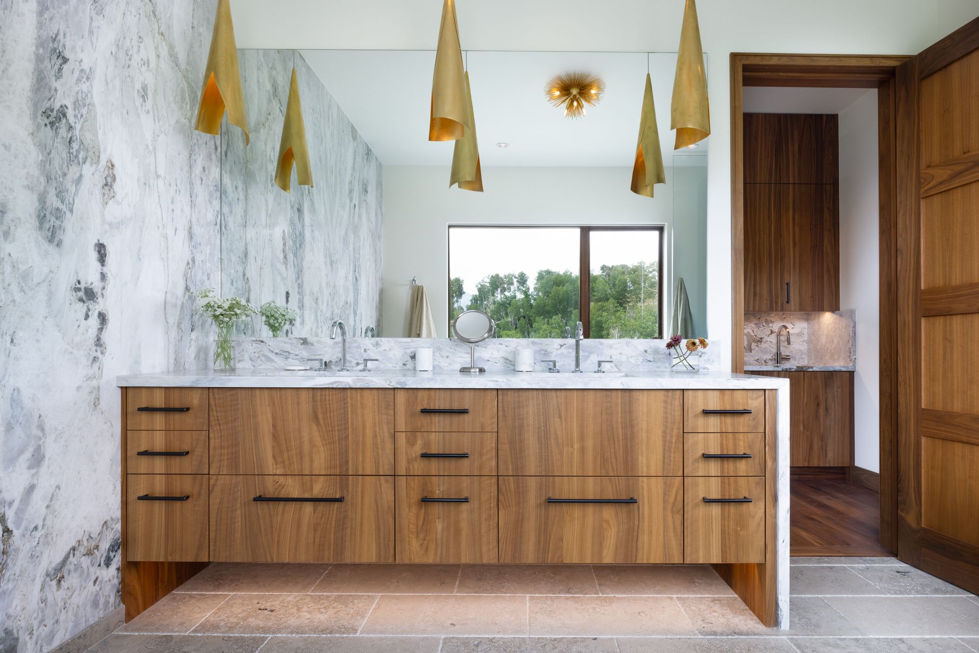 A bathroom with a double sink and a large mirror.