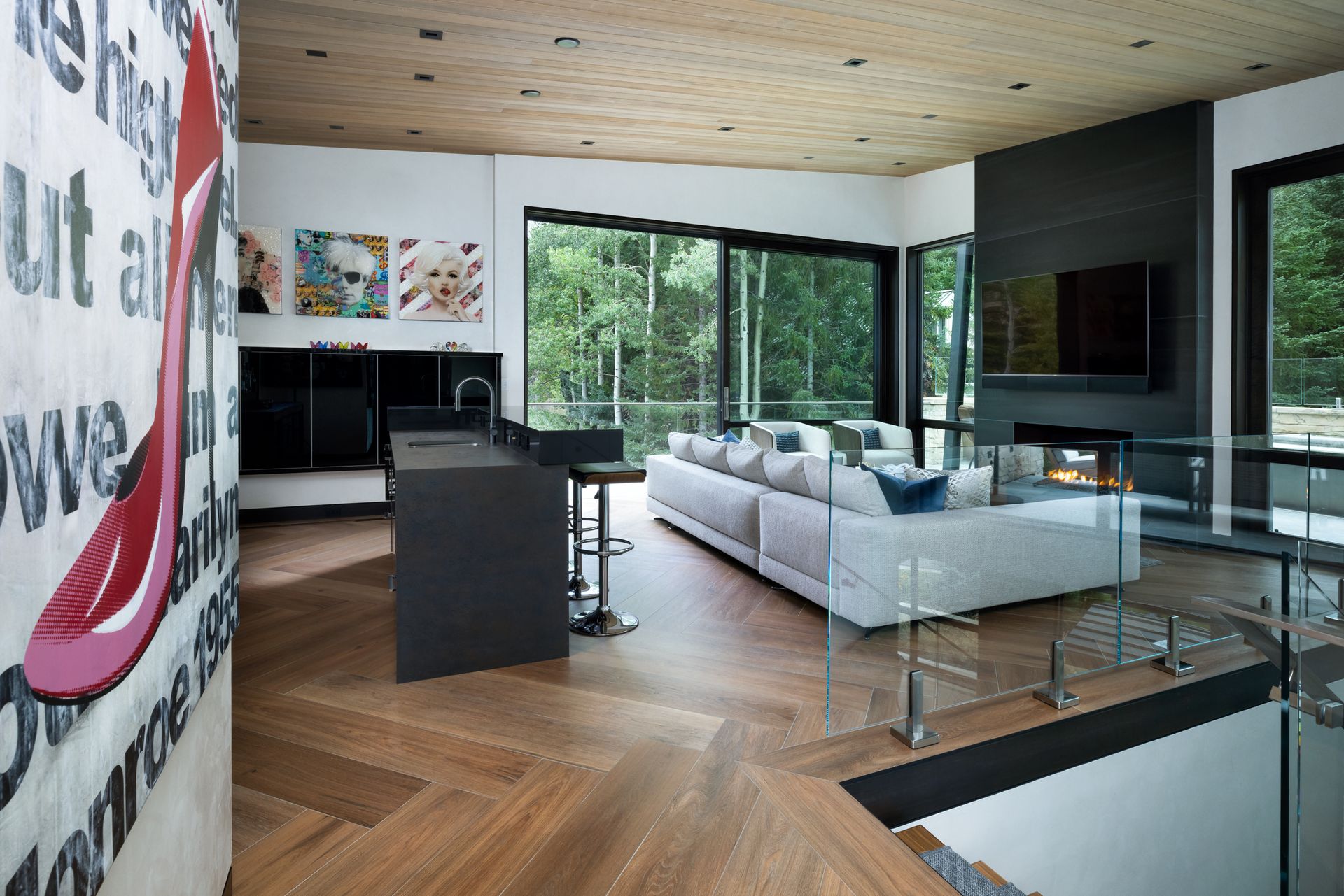 A living room with a white couch and a large window