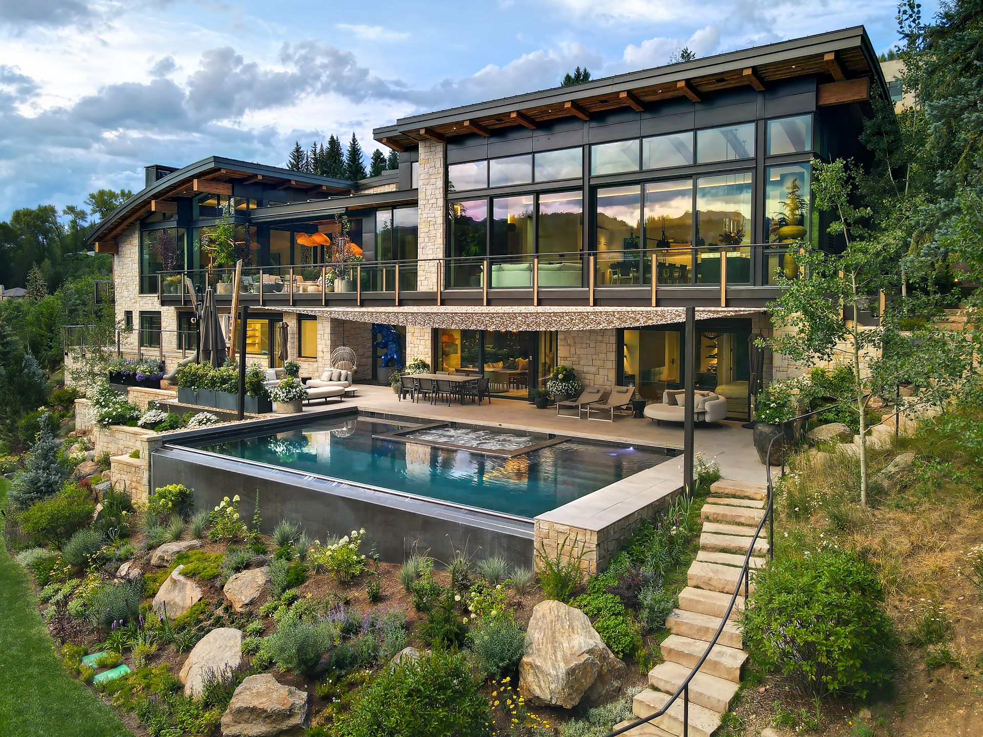 A large house with a large swimming pool in the backyard.