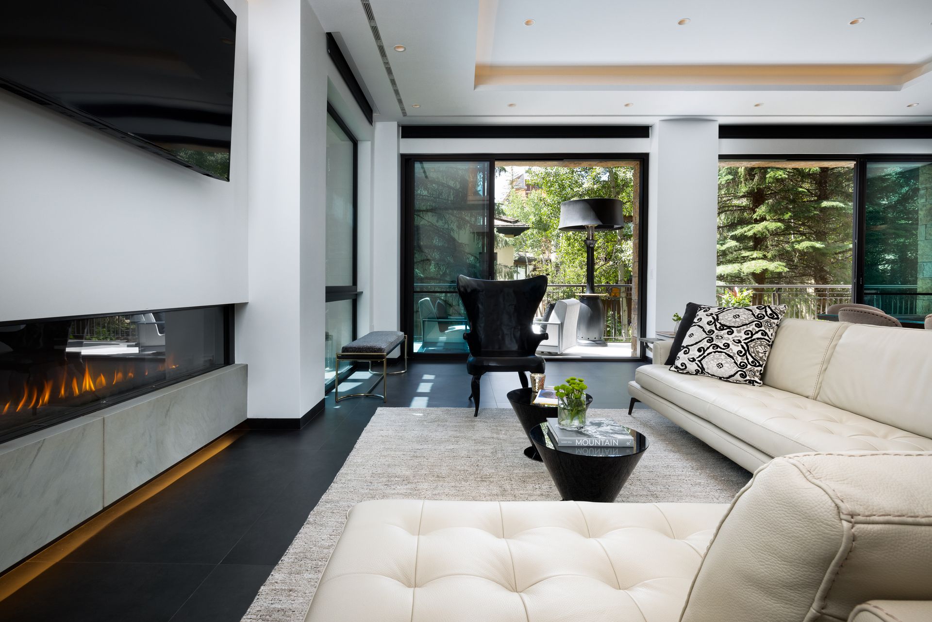 A living room filled with furniture and a fireplace.