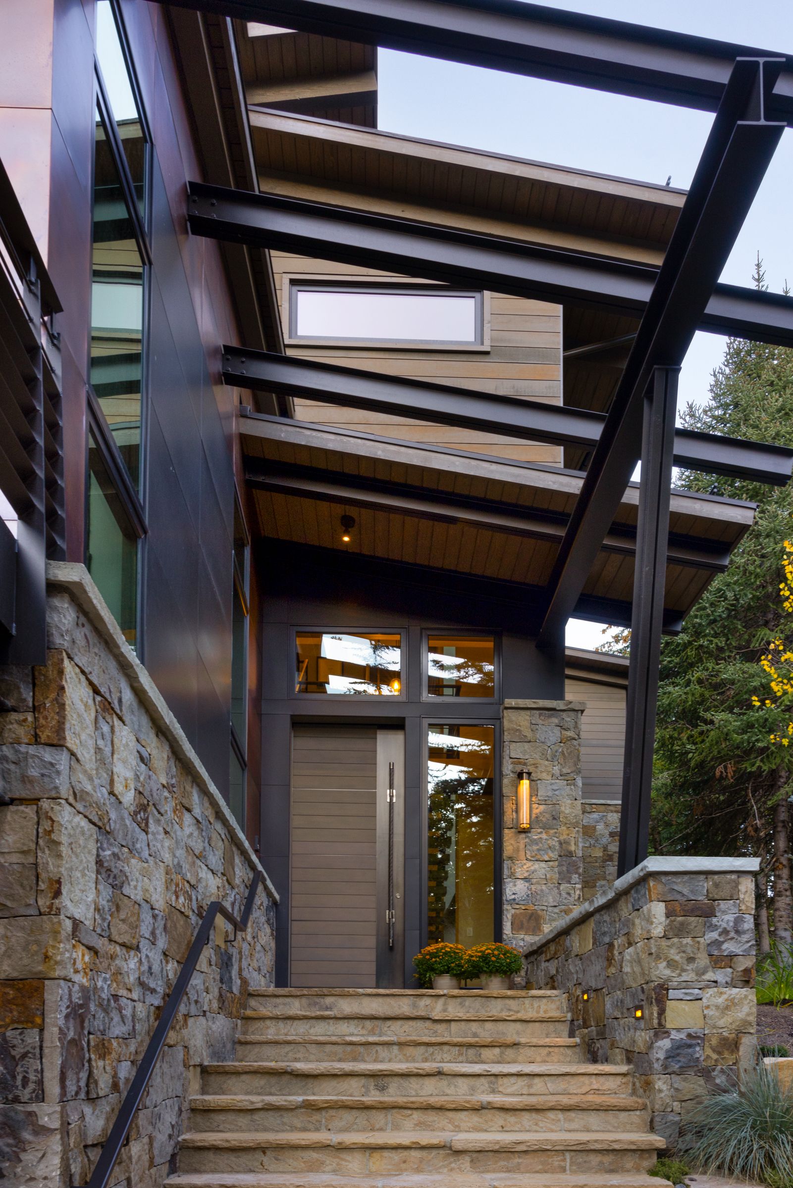 A house with stairs leading up to the front door