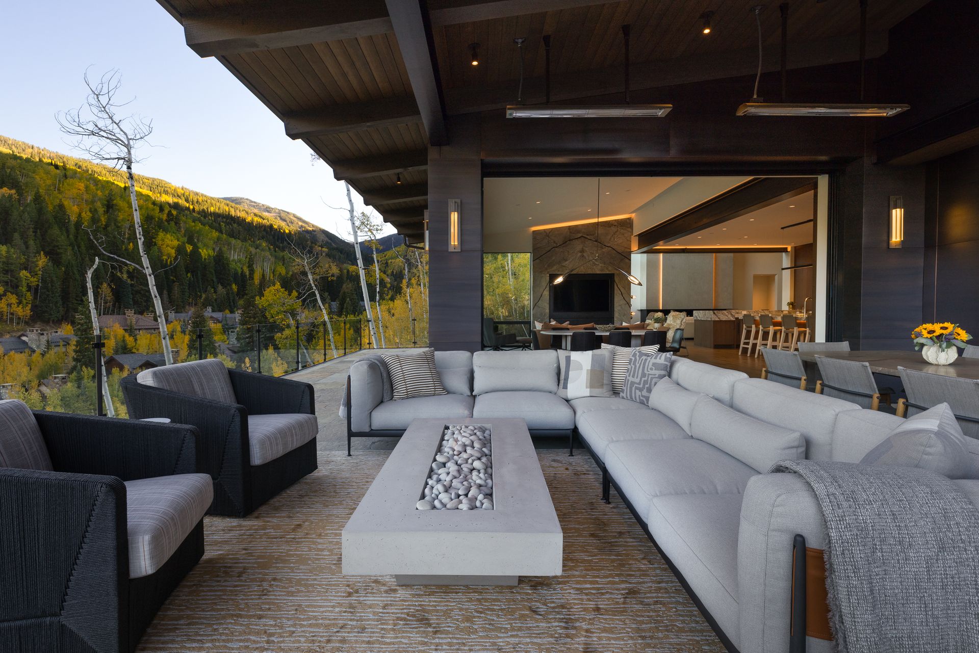 There is a fire pit in the middle of the living room.