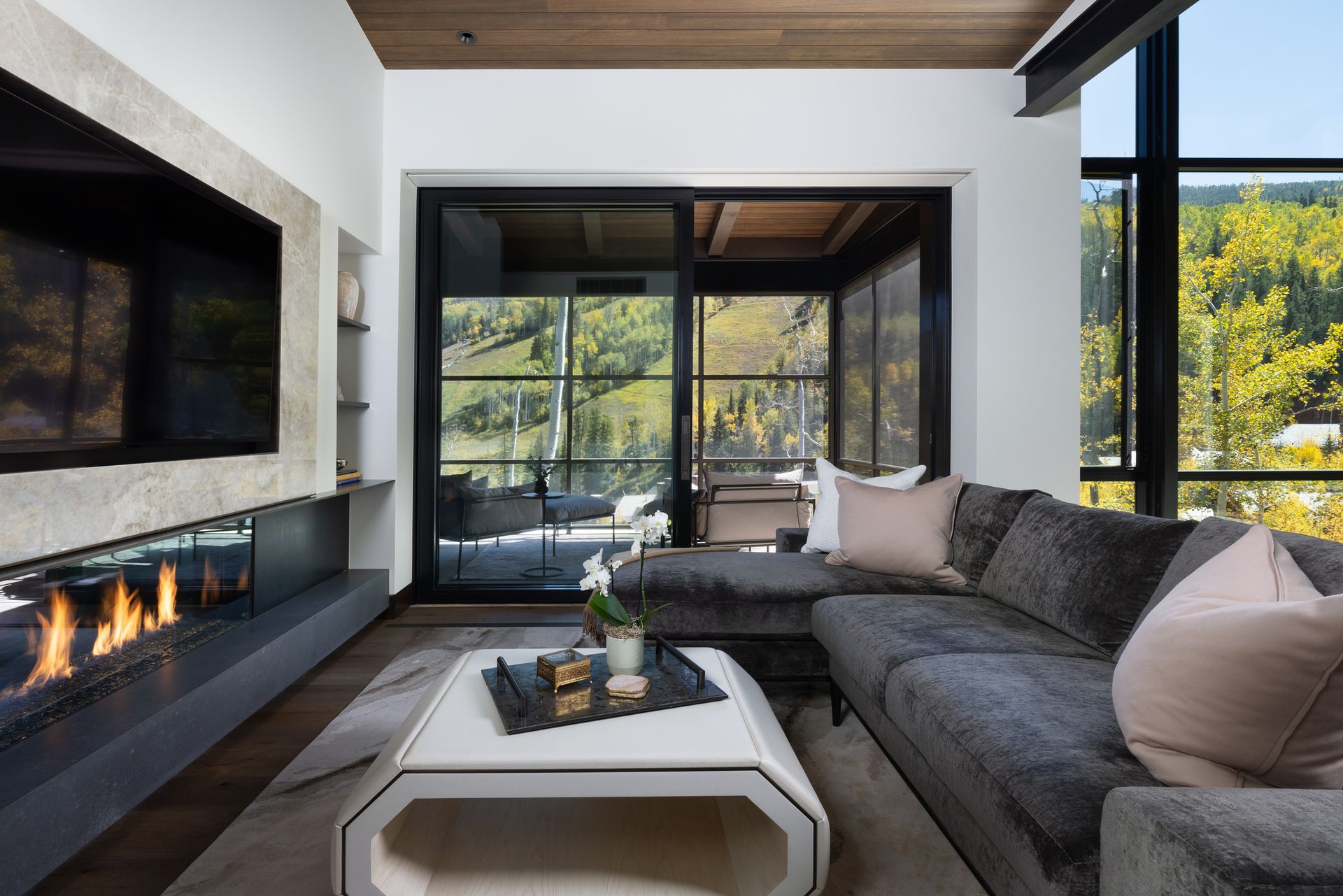 A living room with a couch and a fireplace