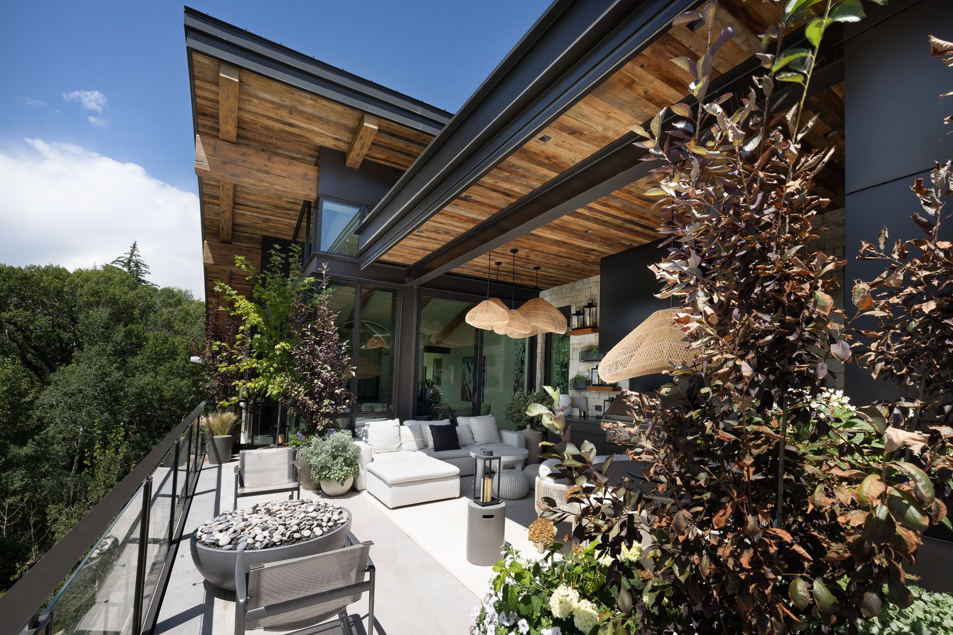 There is a large balcony with a lot of furniture on it.