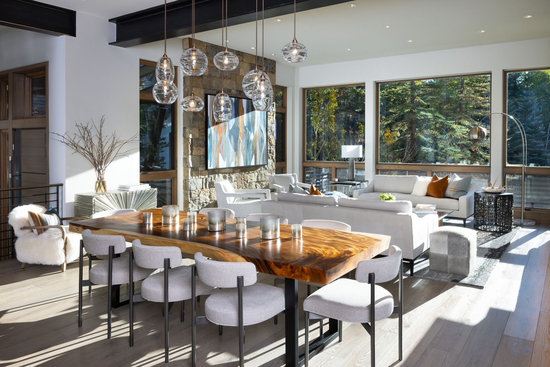 A large living room with a dining table and chairs