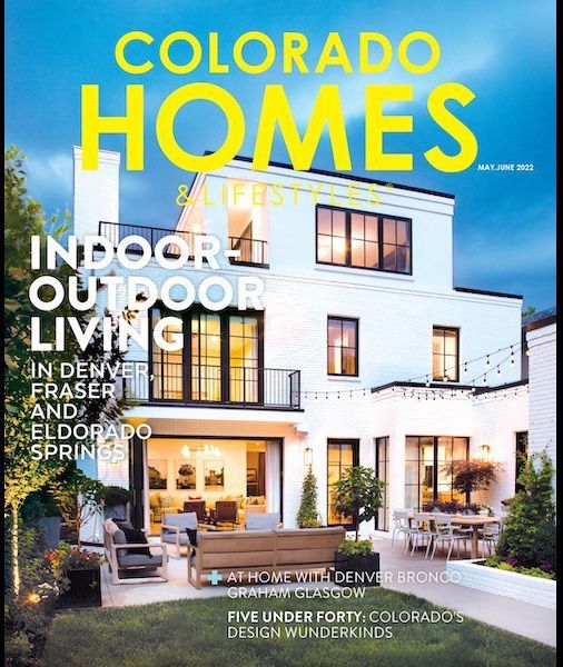The cover of a colorado homes magazine with a white house on it