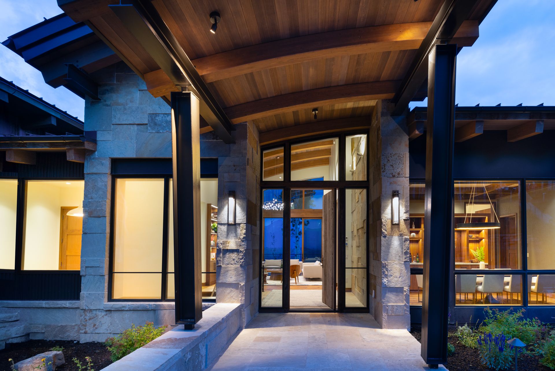 The entrance to a house with a large glass door