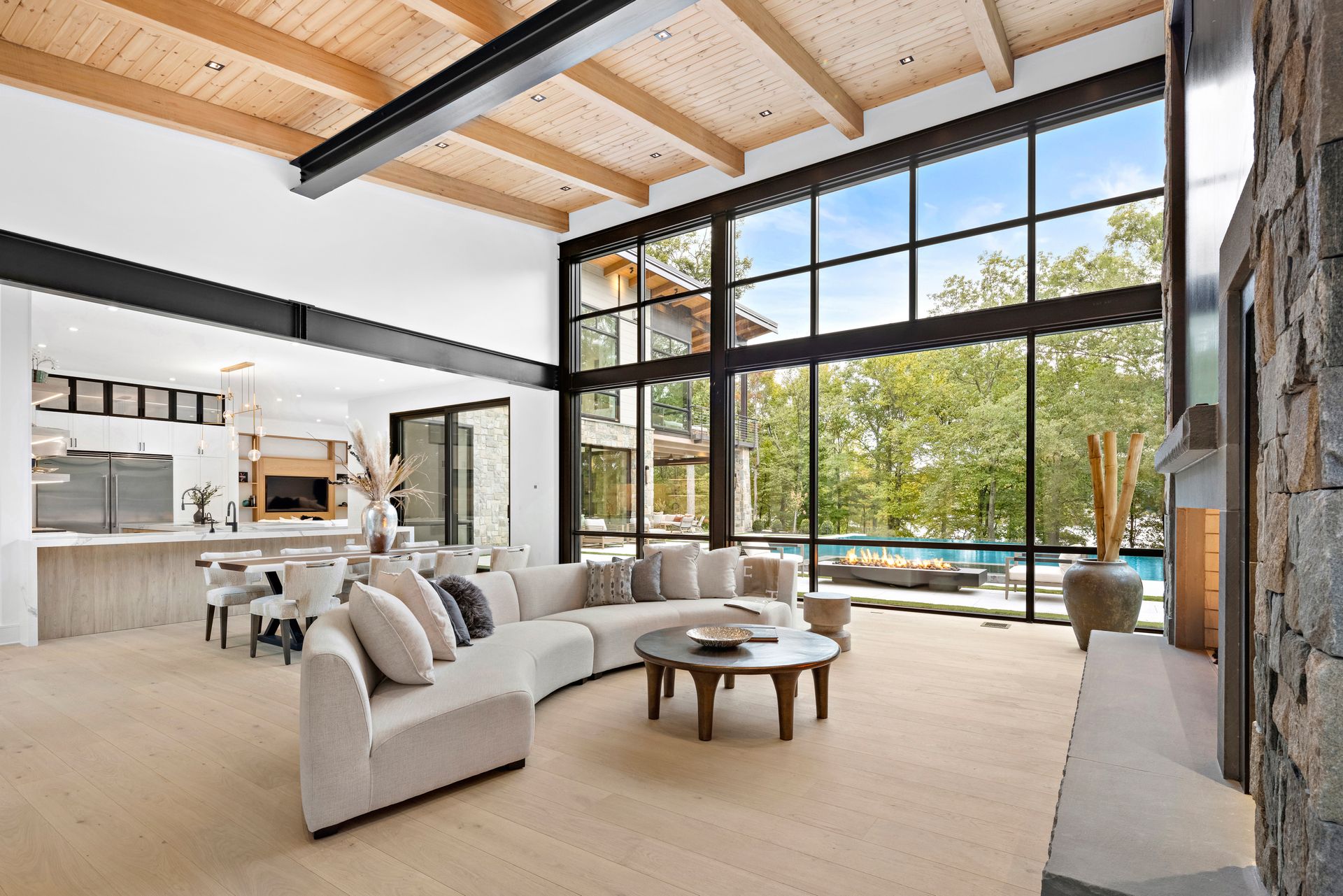 A living room with a lot of windows and a couch.