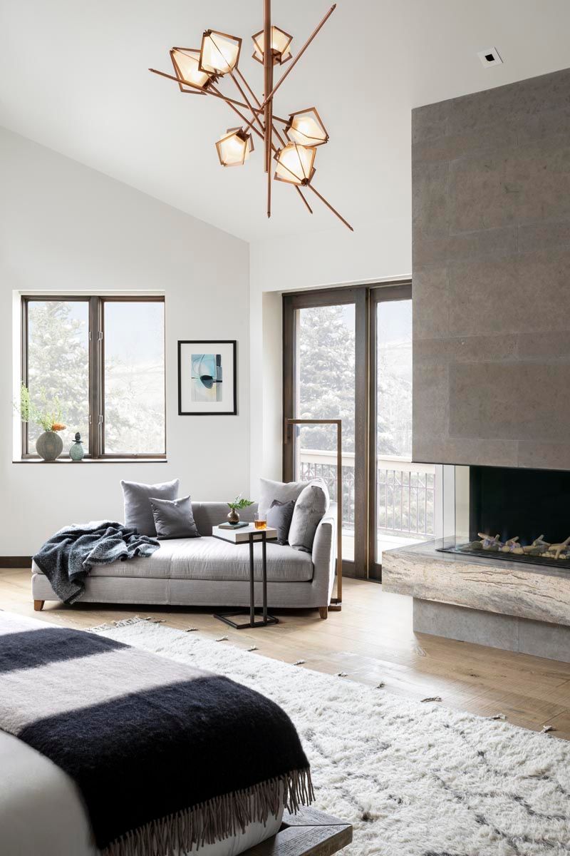 A living room with a couch and a fireplace