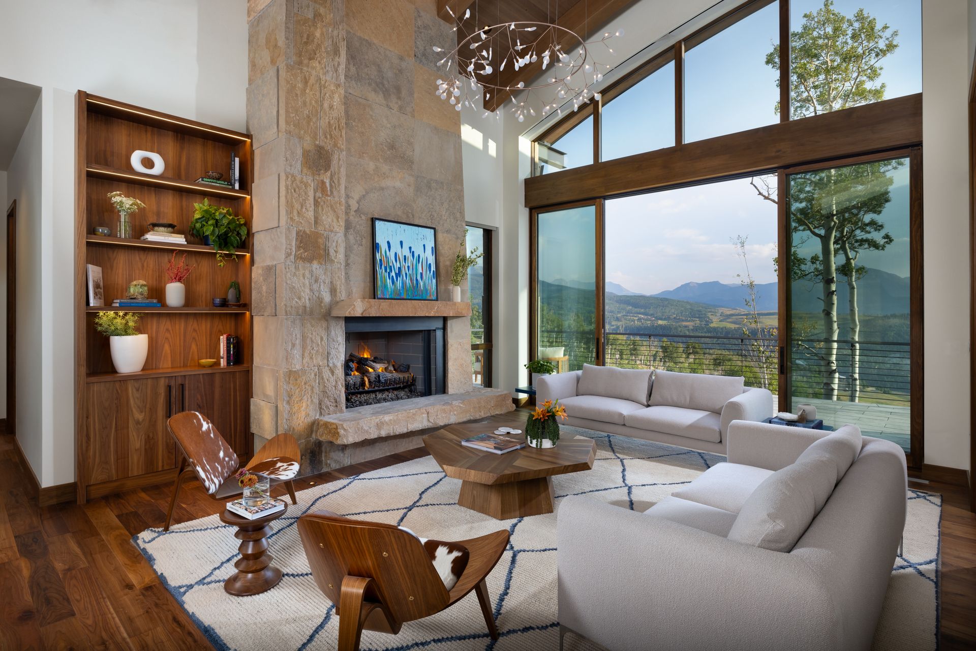 A living room with a fireplace and sliding glass doors