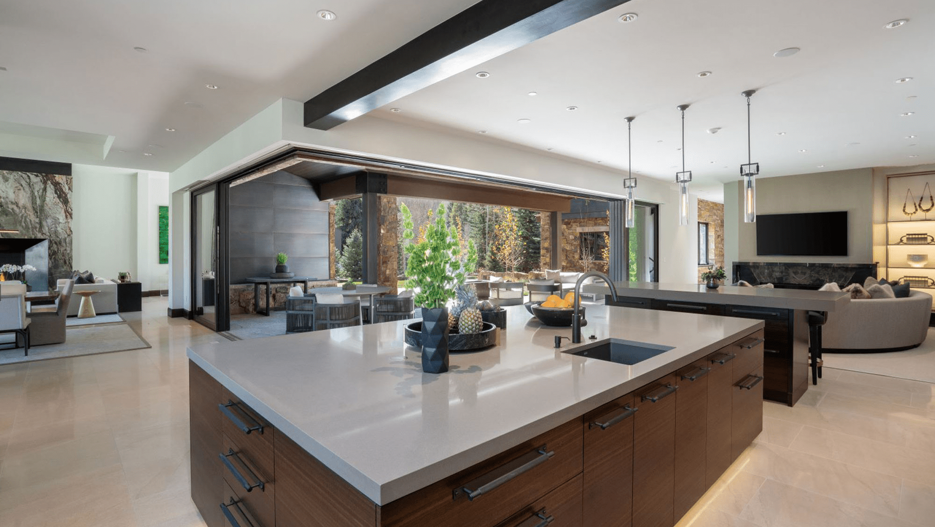A large kitchen with a large island in the middle of the room.