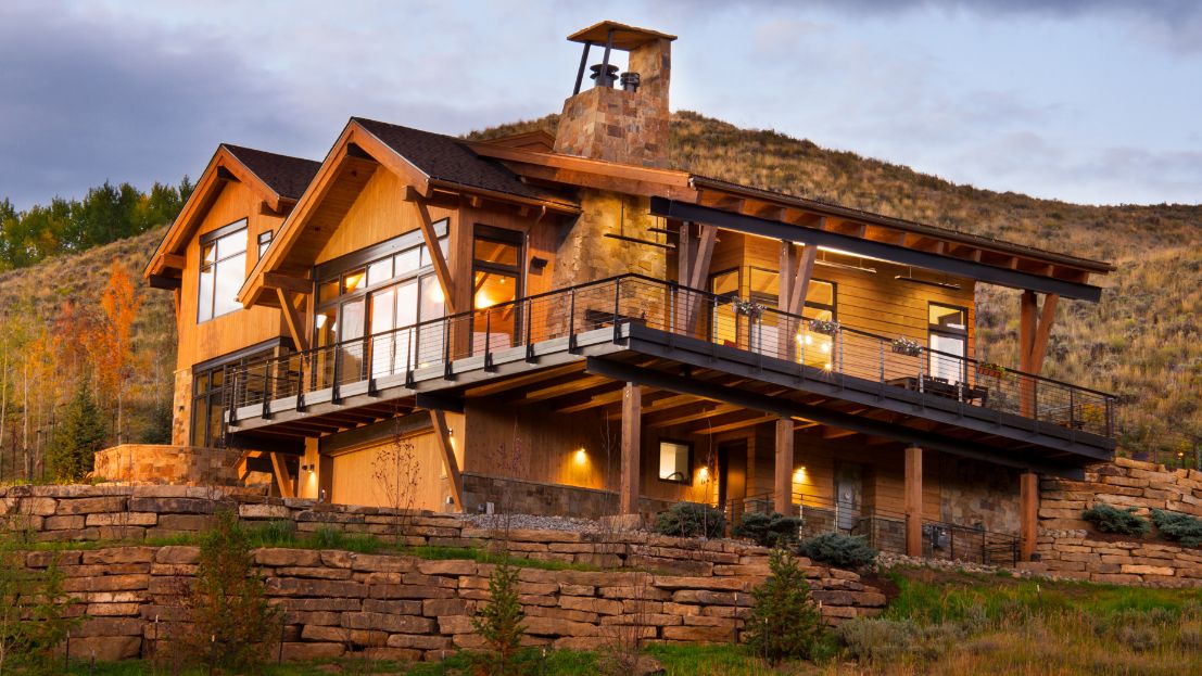 A large house is sitting on top of a hill.