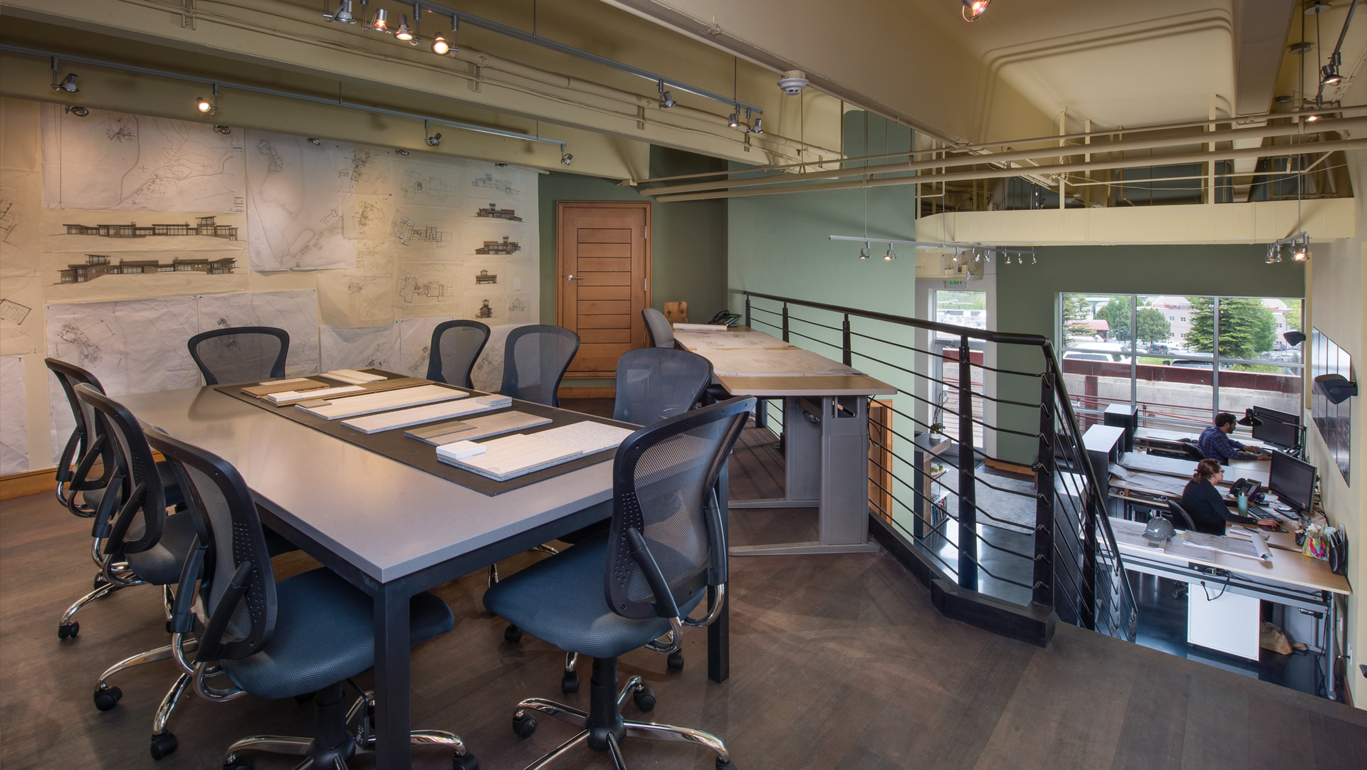 A conference room with a long table and chairs