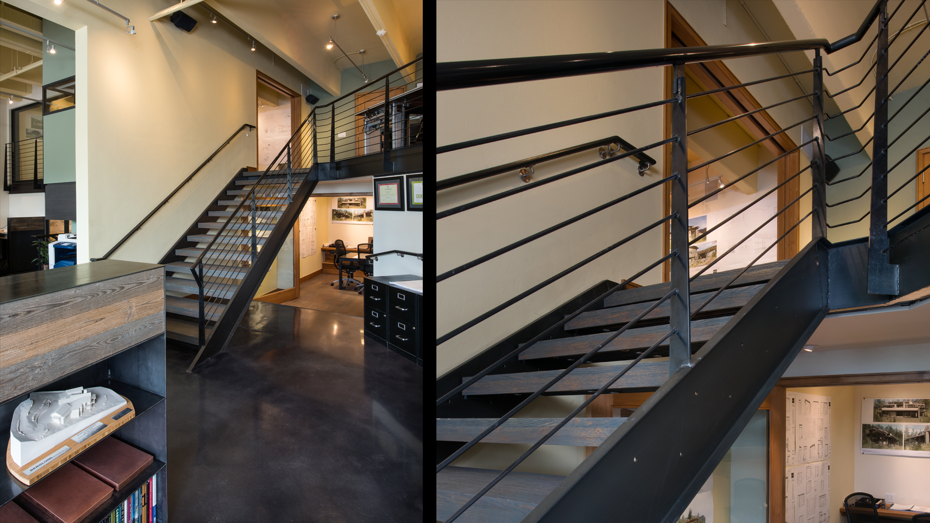 A staircase in a house with a black railing