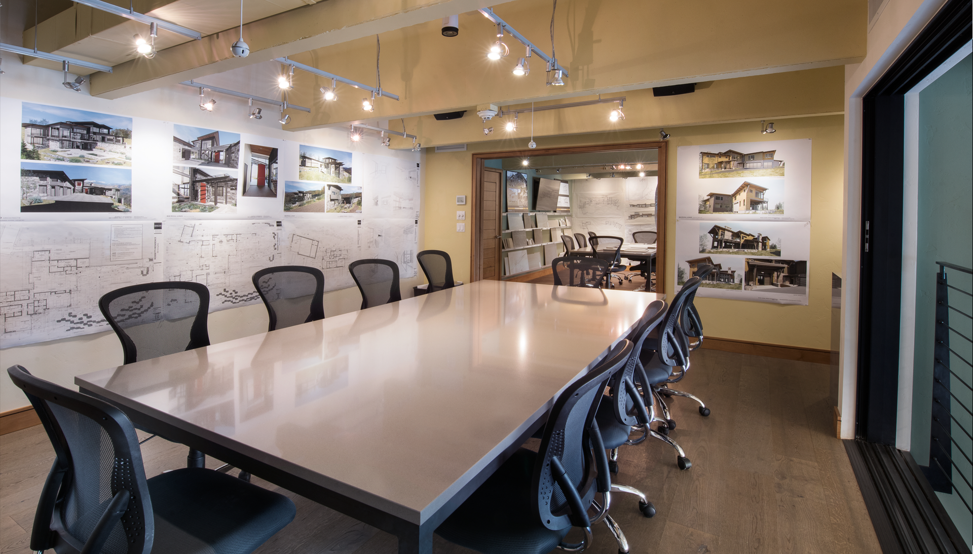 A conference room with a long table and chairs