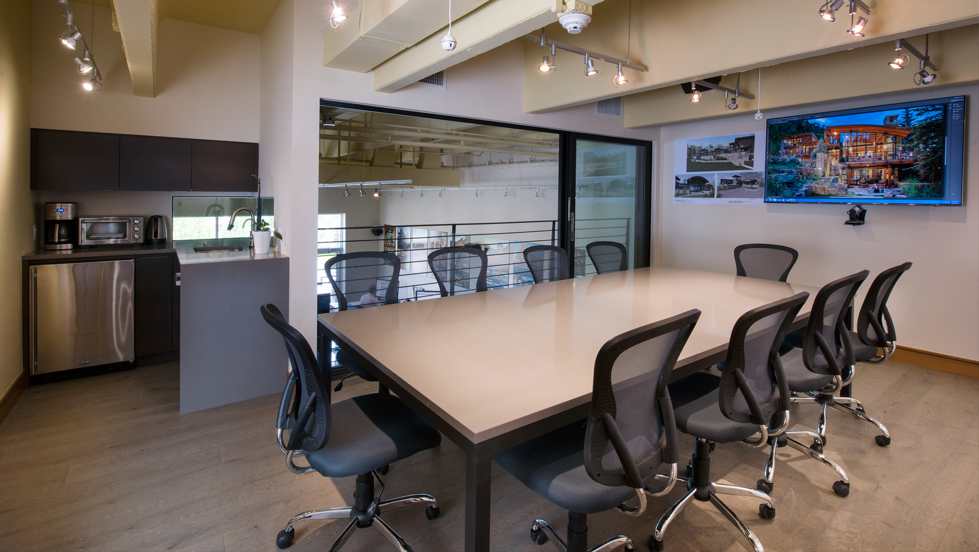 A conference room with a long table and chairs