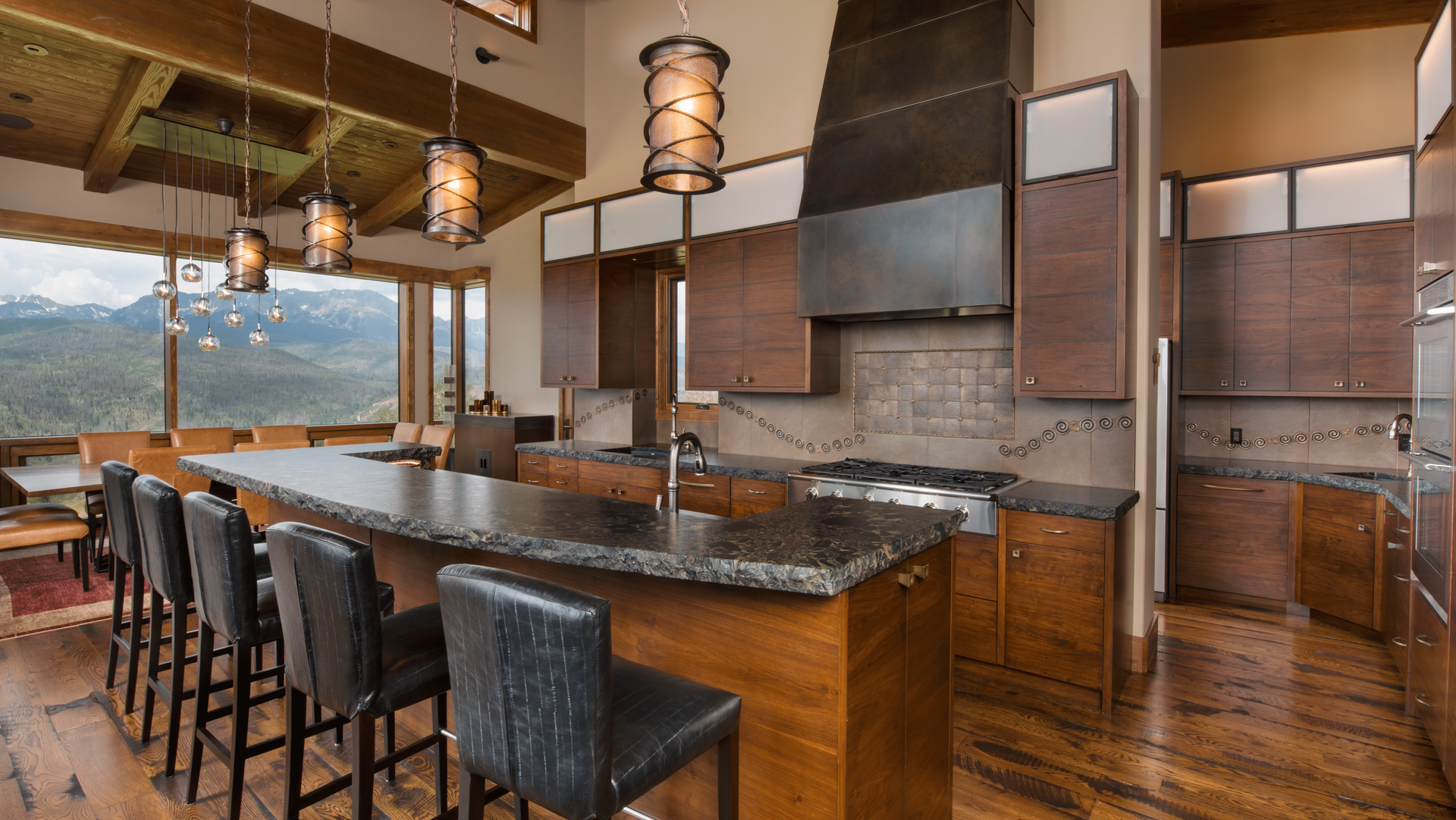 A large kitchen with a large island and stools