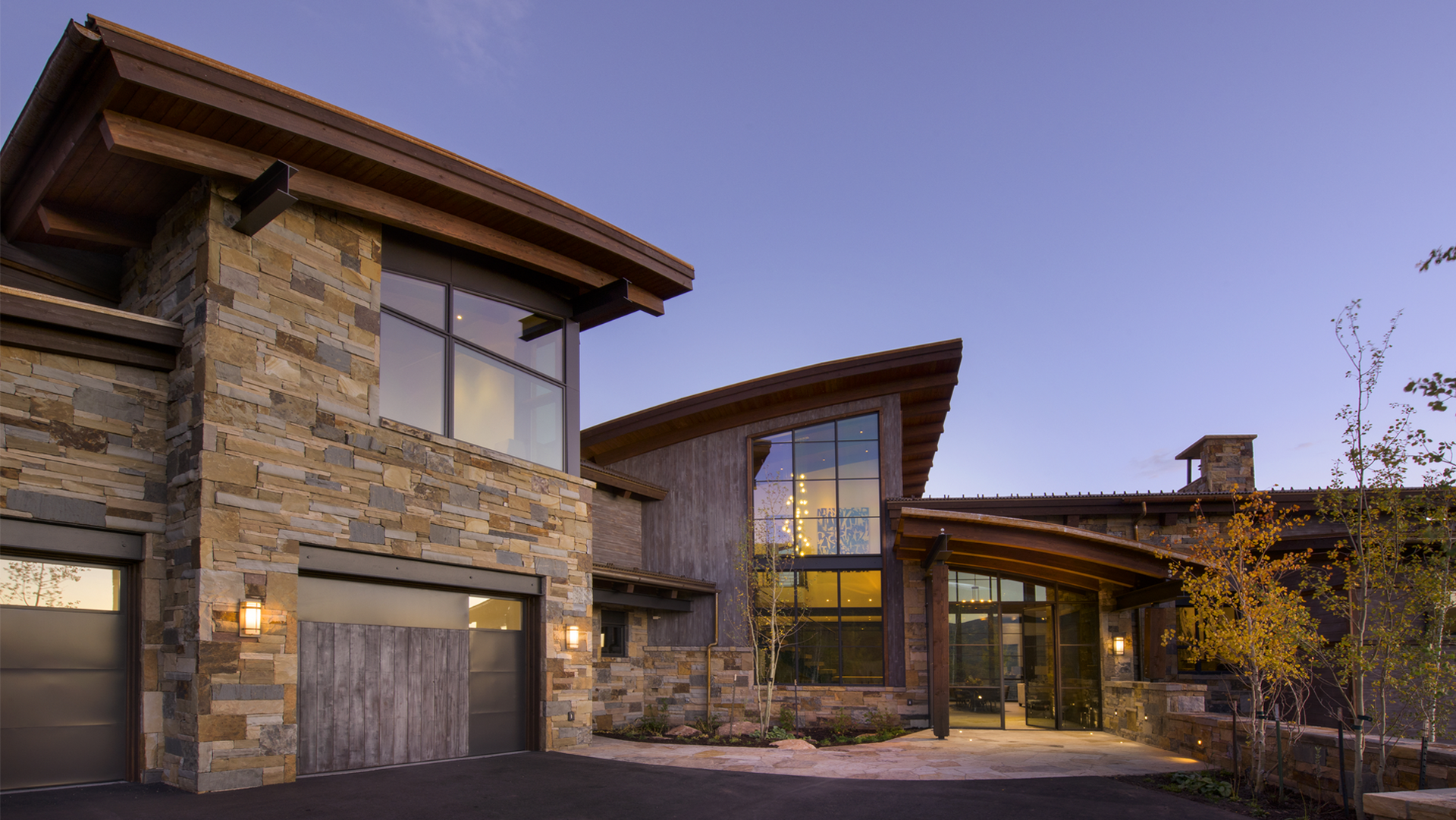 A large house with a lot of windows and a garage
