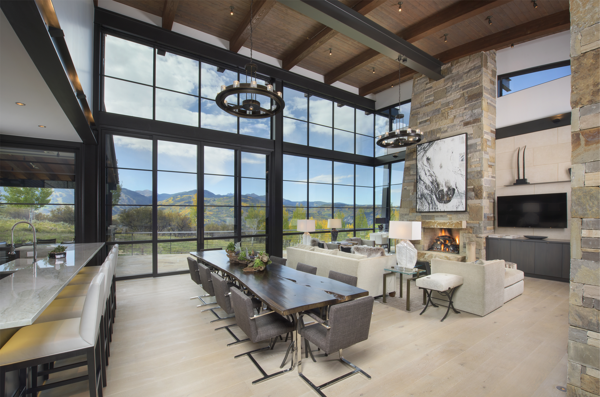 A large living room with a dining table and chairs