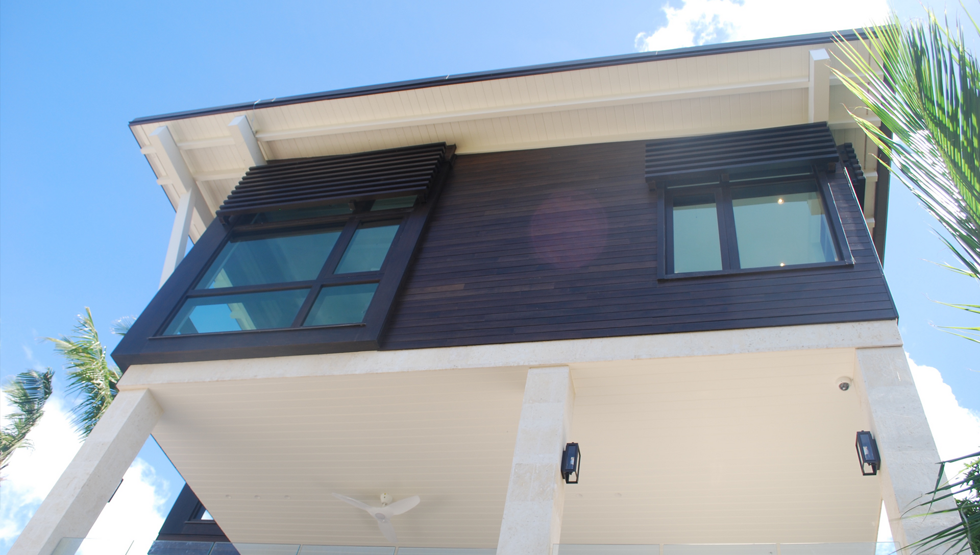 An upside down house with a blue sky in the background