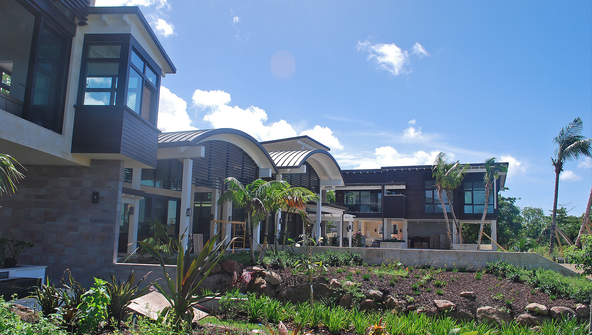 A row of houses with a blue sky in the background