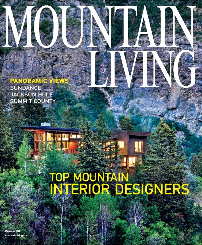 A mountain living magazine with a house on the cover