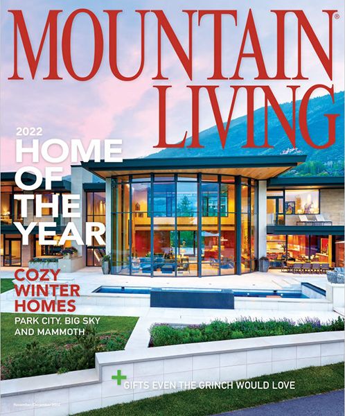A mountain living magazine with a house on the cover