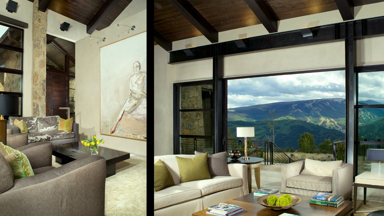 A living room with a lot of furniture and a large window