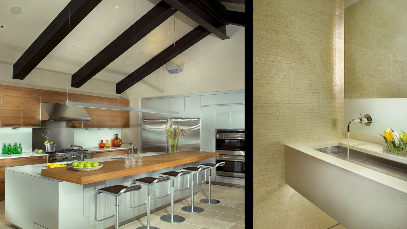 A kitchen with a large island and a sink