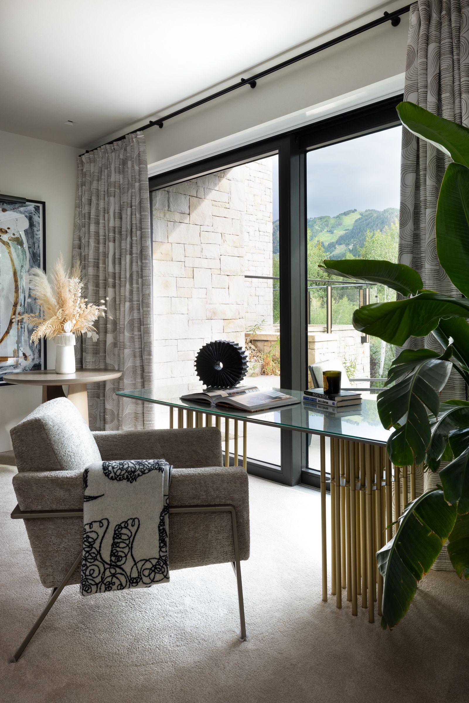 There is a chair and a desk in the room.