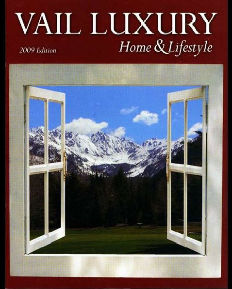 A house with a bridge over a stream in front of it