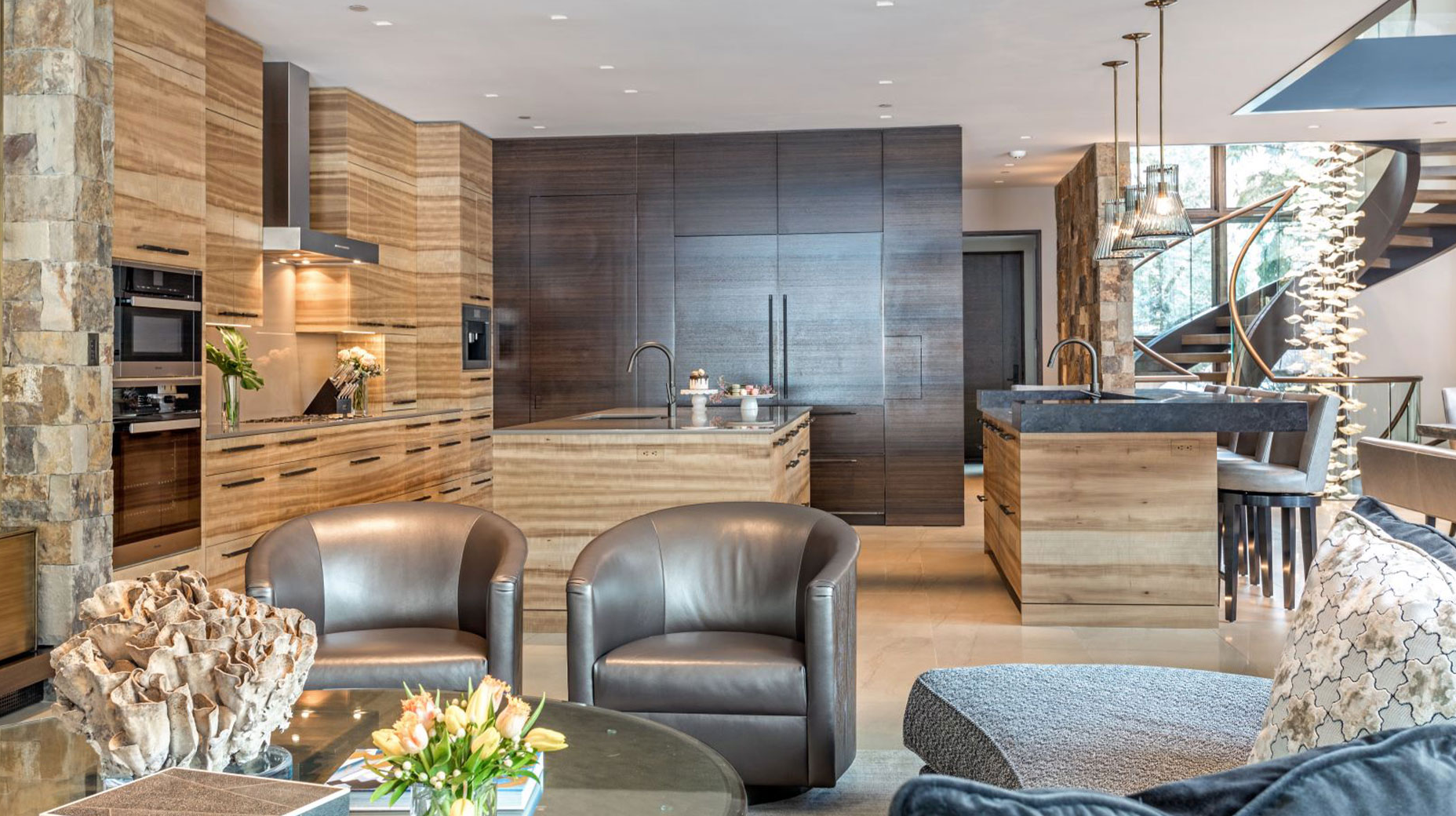 A living room filled with furniture and a kitchen with wooden cabinets.