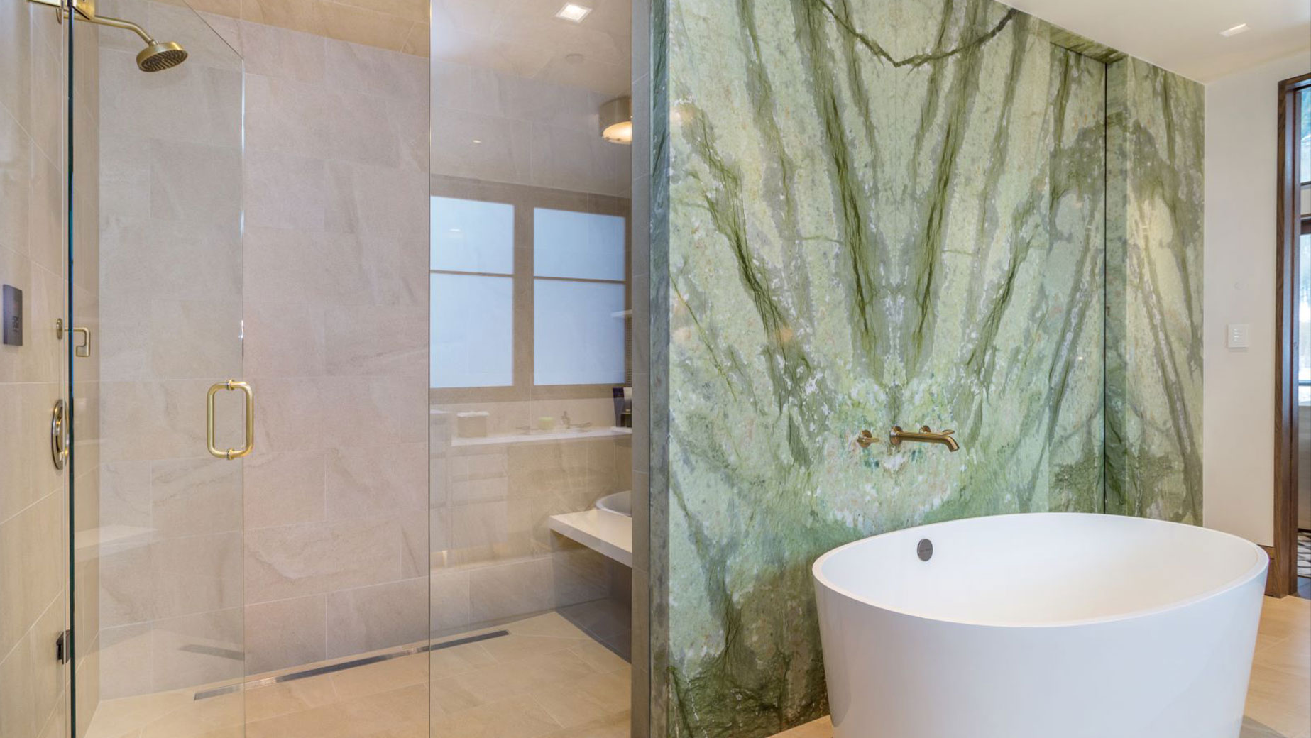 A bedroom with a fireplace and a view of a mountain.