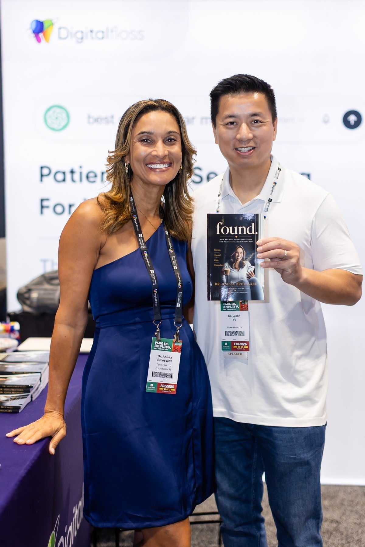 Dr. Anissa Broussard with Dr. Glenn Vo, who is holding a copy of FOUND, at the Digital Floss booth at the Florida Dental Convention 2026