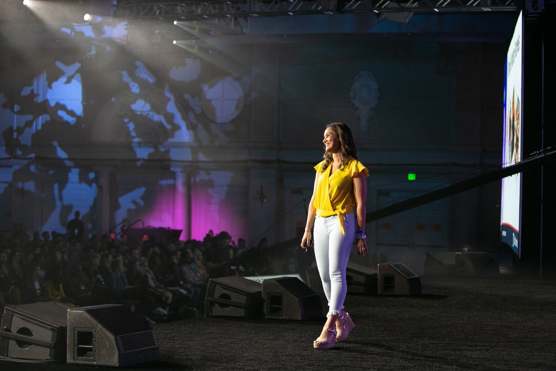 Dr. Anissa Broussard on the main stage at Funnel Hacking Live in front of a packed ballroom