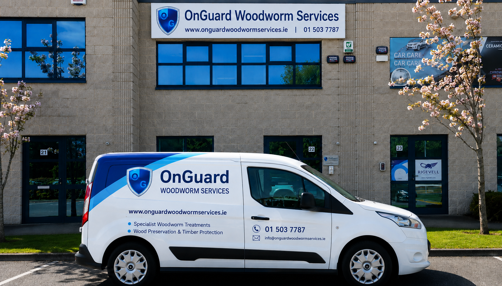 OnGuard Woodcarve Services van parked outside matching office building with blue windows