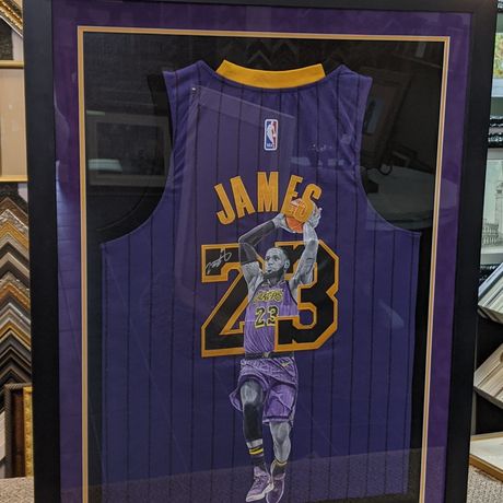 A framed Kansas City Chiefs Patrick Mahomes autographed jersey and photo display featuring a Super Bowl LIV logo.