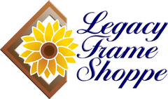 A logo for Legacy Frame Shoppe featuring a yellow sunflower centered within a brown wooden picture frame.