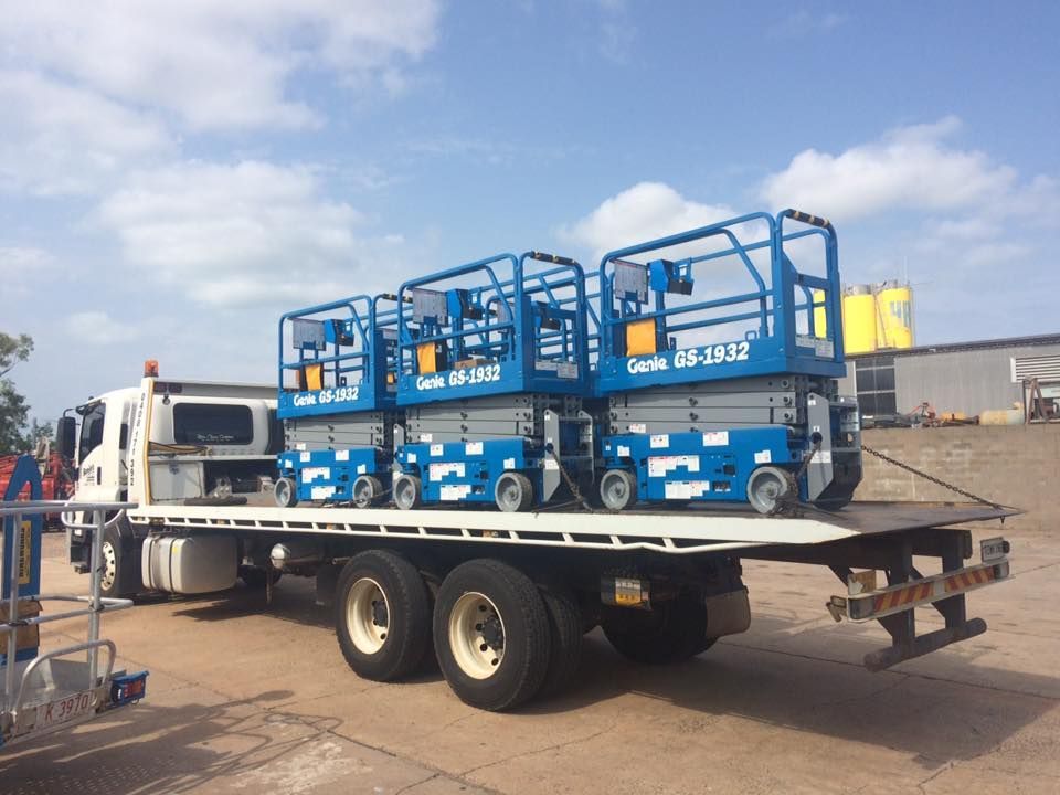 Flatbed Truck Carrying Three Blue Genie Scissor — Banjo's Anytime Towing in Darwin, NT