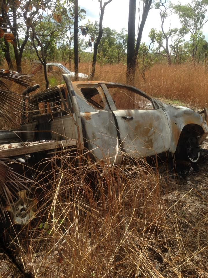 Burnt-out Pickup Truck in a Dry Field — Banjo's Anytime Towing in Coolalinga, NT